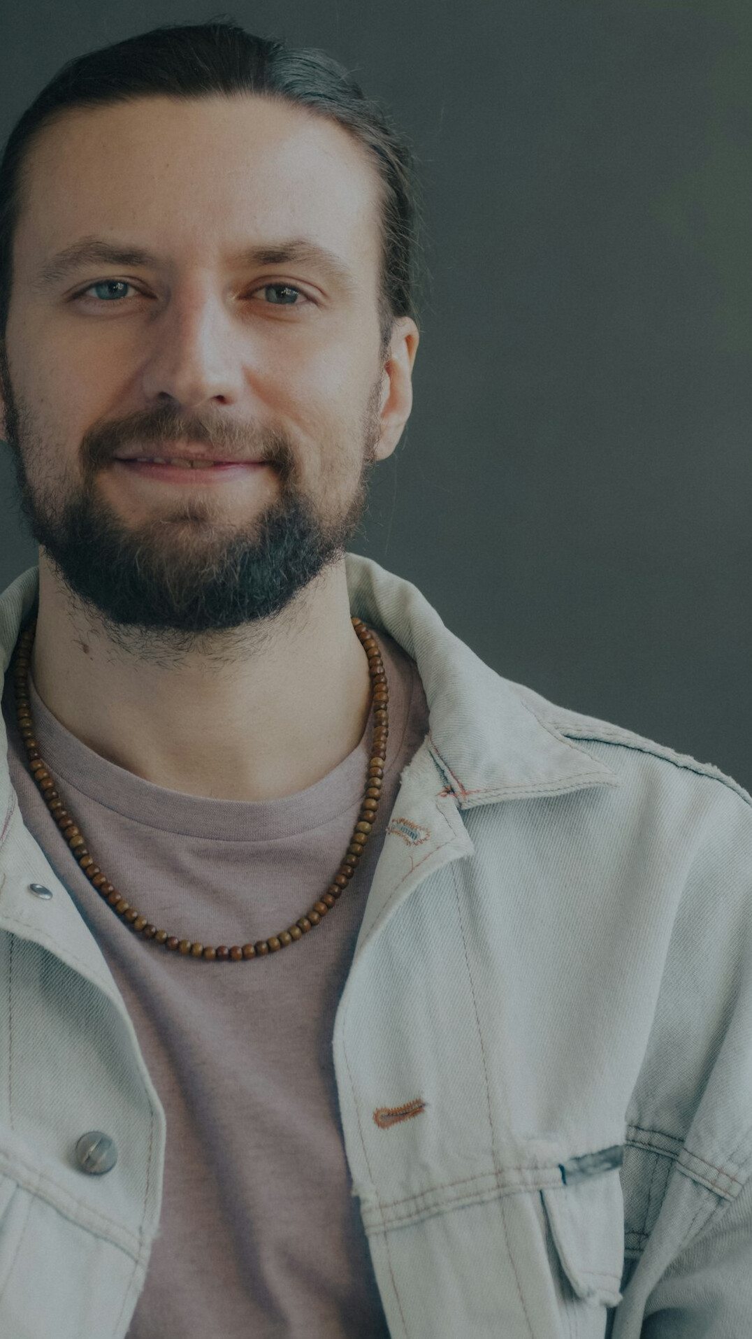Confident smiling man with beard portrait